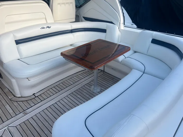 Desert Dream Yacht Photos Pics Luxurious seating area on a 2007 Sea Ray 40 Sundancer yacht with wooden table.