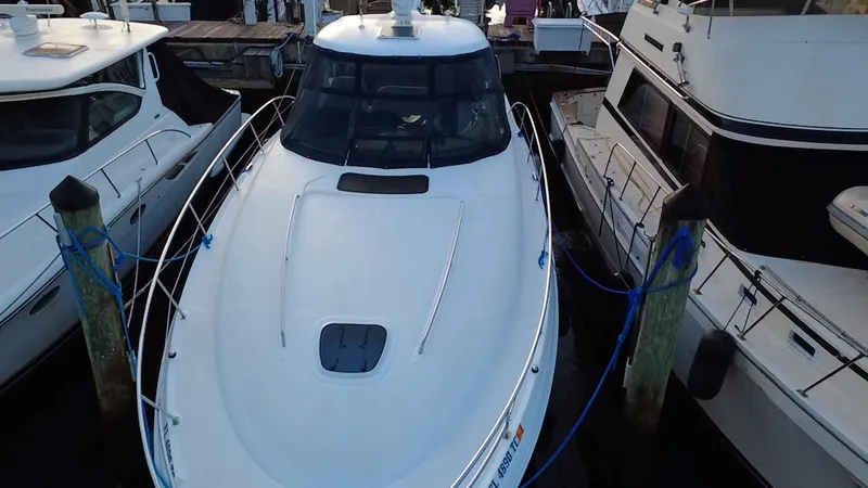 Desert Dream Yacht Photos Pics 2007 Sea Ray 40 Sundancer yacht docked between two boats.