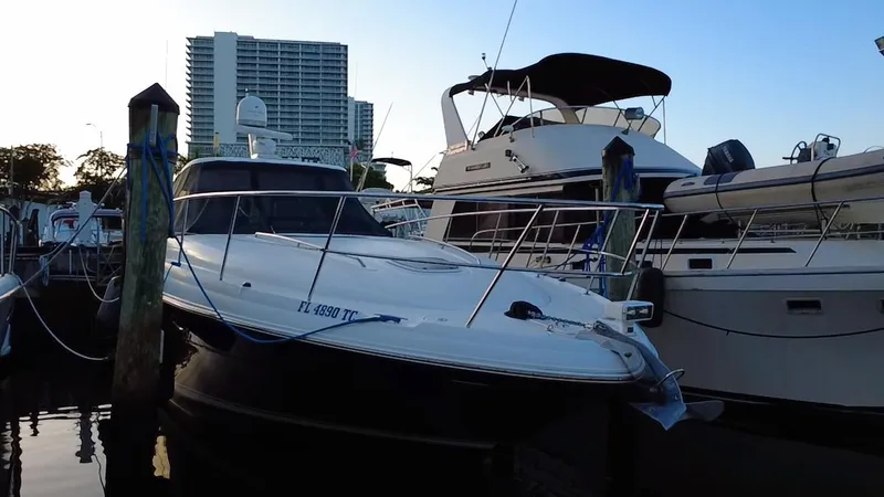 Desert Dream Yacht Photos Pics 2007 Sea Ray 40 Sundancer yacht docked at marina, with cityscape background.
