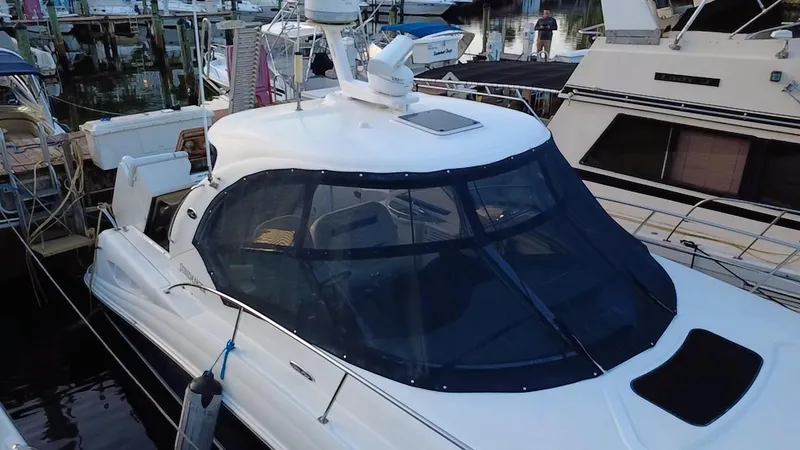 Desert Dream Yacht Photos Pics 2007 Sea Ray 40 Sundancer yacht docked at marina, featuring sleek design and enclosed cockpit.