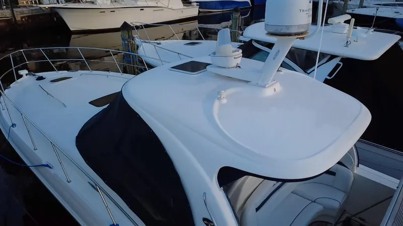 Desert Dream Yacht Photos Pics 2007 Sea Ray 40 Sundancer yacht docked at marina, featuring sleek white design.