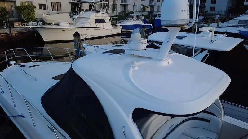 Desert Dream Yacht Photos Pics 2007 Sea Ray 40 Sundancer yacht docked at marina, featuring sleek design and radar equipment.