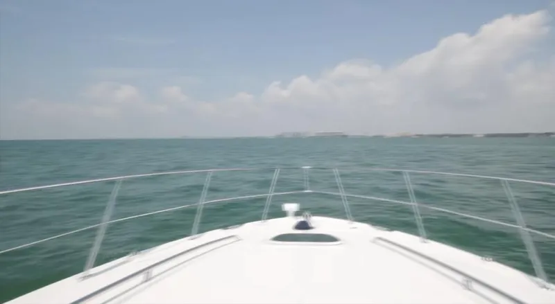 Desert Dream Yacht Photos Pics Bow view of 2007 Sea Ray 40 Sundancer cruising on open water under clear skies.