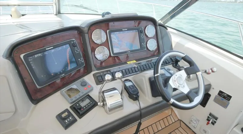 Desert Dream Yacht Photos Pics Helm of 2007 Sea Ray 40 Sundancer with navigation screens and controls.