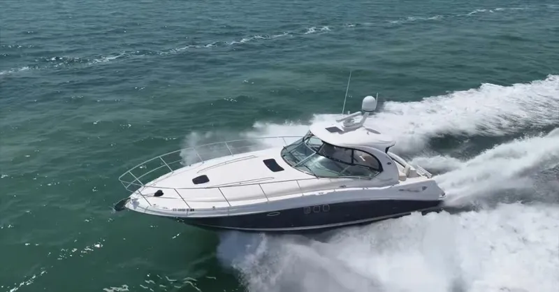 Desert Dream Yacht Photos Pics 2007 Sea Ray 40 Sundancer yacht cruising on open water, creating a dynamic wake.