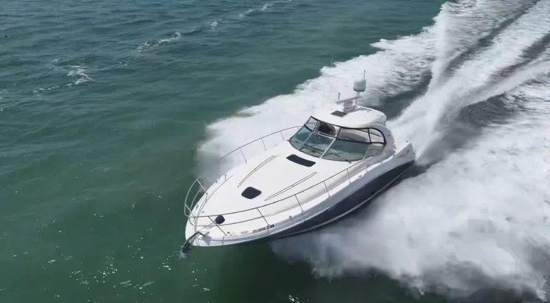 Desert Dream Yacht Photos Pics 2007 Sea Ray 40 Sundancer cruising swiftly on open water.