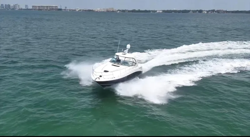 Desert Dream Yacht Photos Pics 2007 Sea Ray 40 Sundancer cruising on open water, creating a dynamic wake.