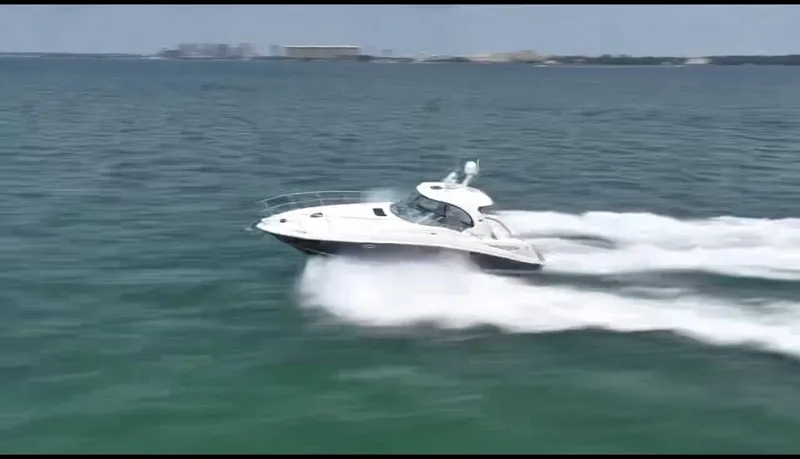 Desert Dream Yacht Photos Pics 2007 Sea Ray 40 Sundancer cruising swiftly on open water.