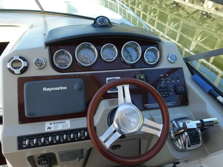  Yacht Photos Pics Dashboard of 2013 Sea Ray 370 Venture boat with steering wheel and gauges.