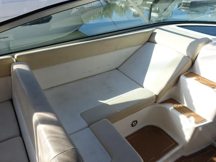  Yacht Photos Pics 2013 Sea Ray 370 Venture boat interior with beige seating and cup holders.