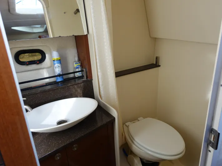  Yacht Photos Pics 2013 Sea Ray 370 Venture bathroom with sink, mirror, and toilet.