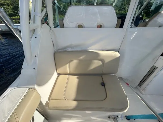  Yacht Photos Pics 2017 Pursuit DC 325 Dual Console boat interior with beige seating and white accents.