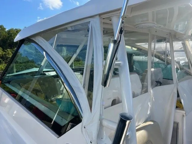  Yacht Photos Pics 2017 Pursuit DC 325 Dual Console boat with clear enclosure and rod holders.