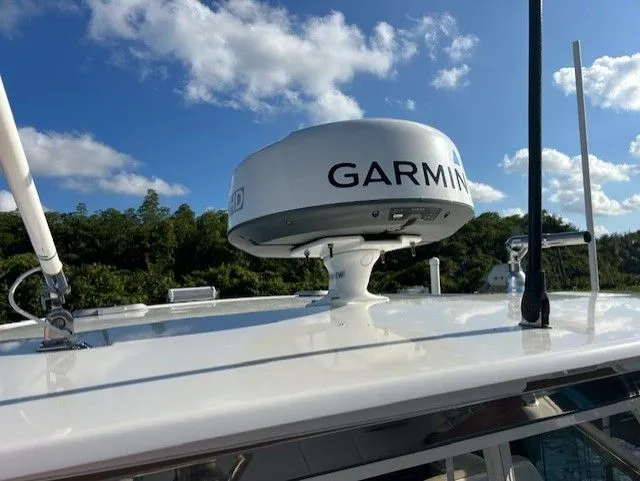  Yacht Photos Pics Garmin radar on 2017 Pursuit DC 325 Dual Console boat under blue sky.