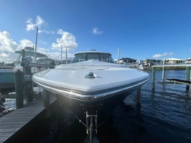  Yacht Photos Pics 2017 Pursuit DC 325 Dual Console boat docked under a clear blue sky.