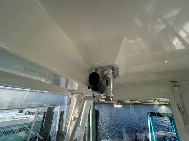  Yacht Photos Pics 2017 Pursuit DC 325 Dual Console boat interior with rod holder, overlooking water.