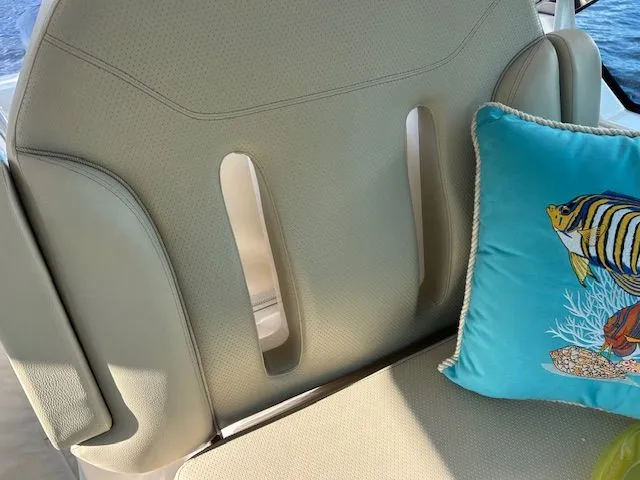 Yacht Photos Pics 2017 Pursuit DC 325 Dual Console boat seat with decorative fish pillow.