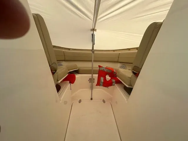 Yacht Photos Pics 2017 Pursuit DC 325 Dual Console interior with beige seating and life jackets.