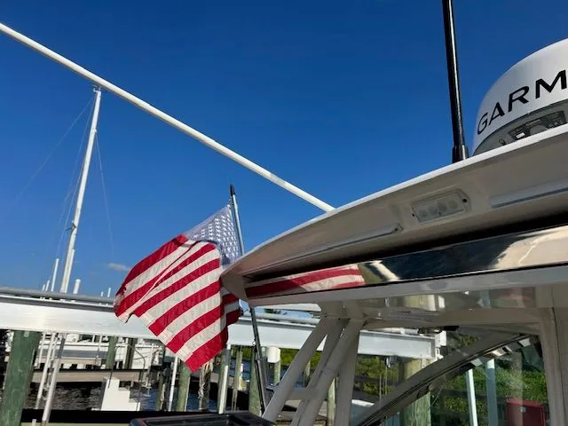  Yacht Photos Pics 2017 Pursuit DC 325 Dual Console boat with American flag and Garmin equipment.