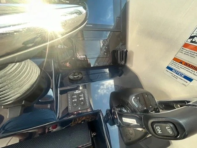  Yacht Photos Pics Control panel of 2017 Pursuit DC 325 Dual Console boat with steering and navigation equipment.