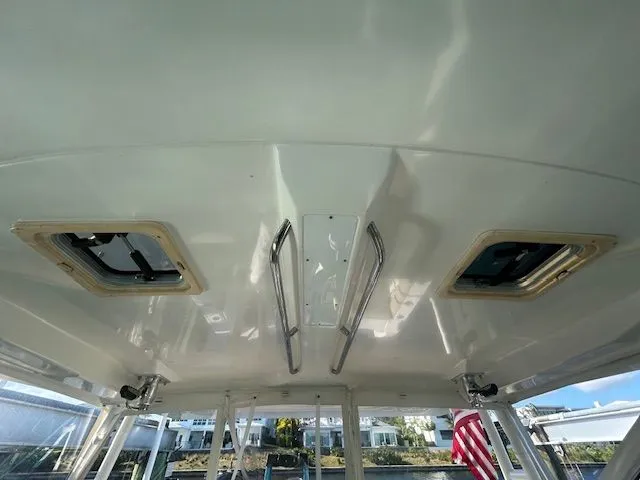  Yacht Photos Pics 2017 Pursuit DC 325 Dual Console boat interior ceiling with hatches and grab rails.