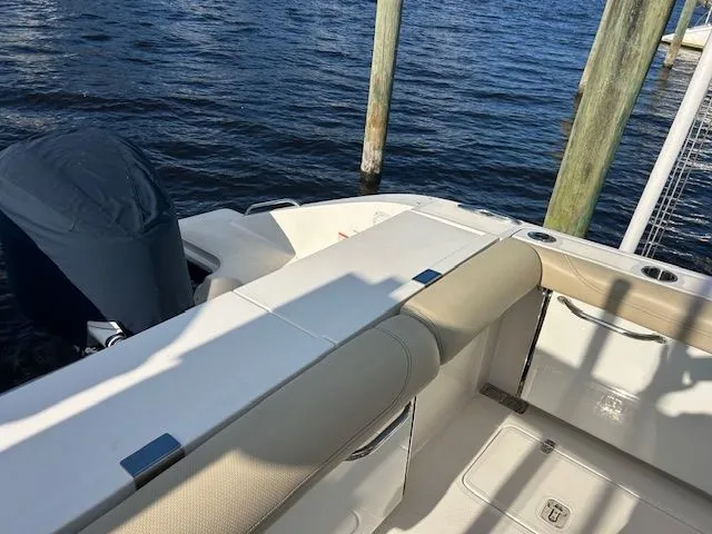  Yacht Photos Pics 2017 Pursuit DC 325 Dual Console boat docked, featuring spacious seating and outboard motor.