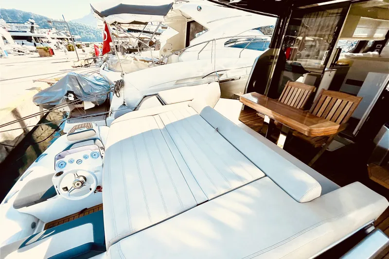  Yacht Photos Pics Luxurious 2020 Cranchi E 52F Evoluzione yacht with spacious deck and elegant seating area.