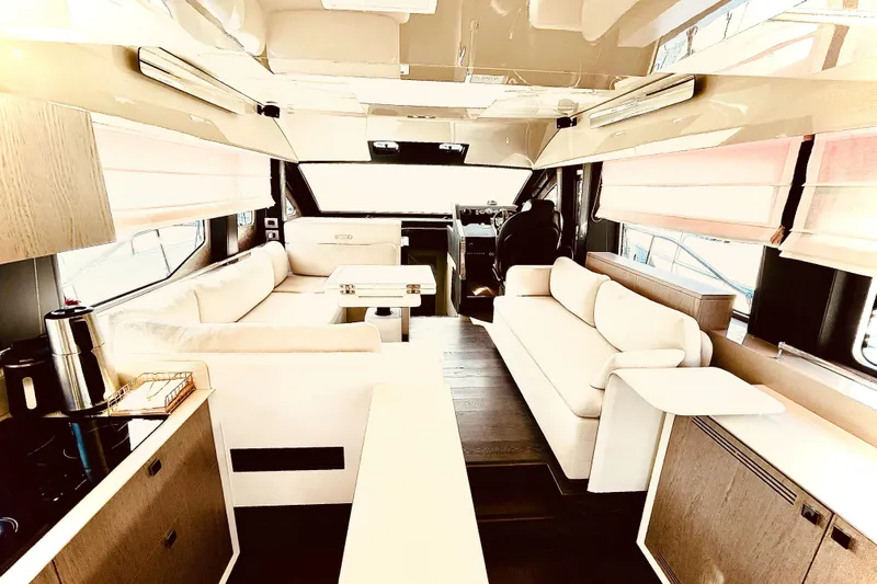  Yacht Photos Pics Luxurious interior of 2020 Cranchi E 52F Evoluzione yacht with elegant seating and modern design.