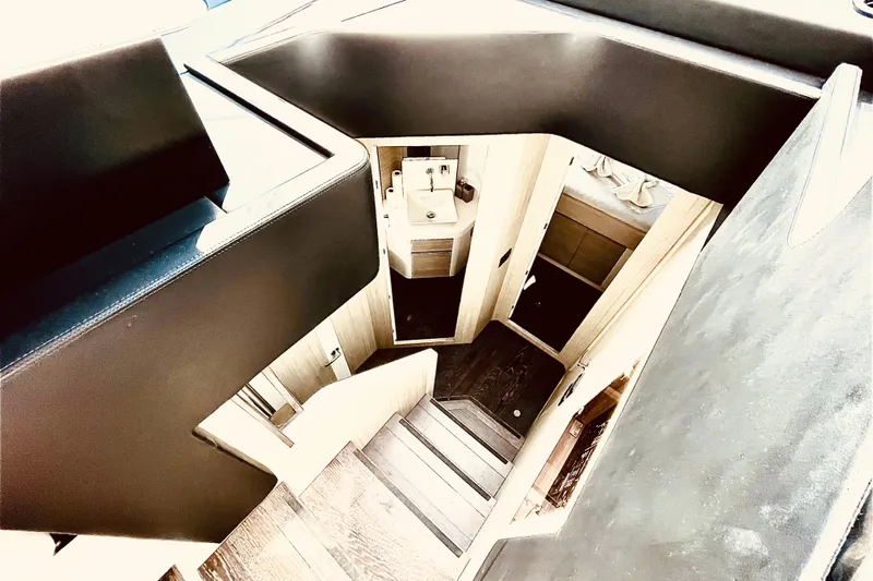  Yacht Photos Pics Interior view of 2020 Cranchi E 52F Evoluzione yacht, featuring modern staircase design.