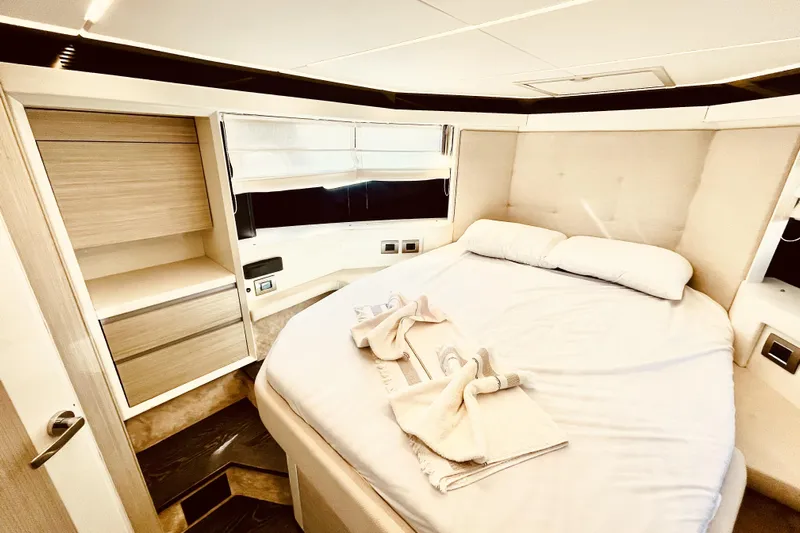  Yacht Photos Pics Luxurious bedroom interior of 2020 Cranchi E 52F Evoluzione yacht, featuring elegant design.