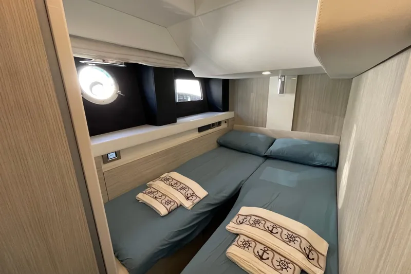  Yacht Photos Pics Luxurious cabin interior of 2020 Cranchi E 52F Evoluzione yacht with twin beds.