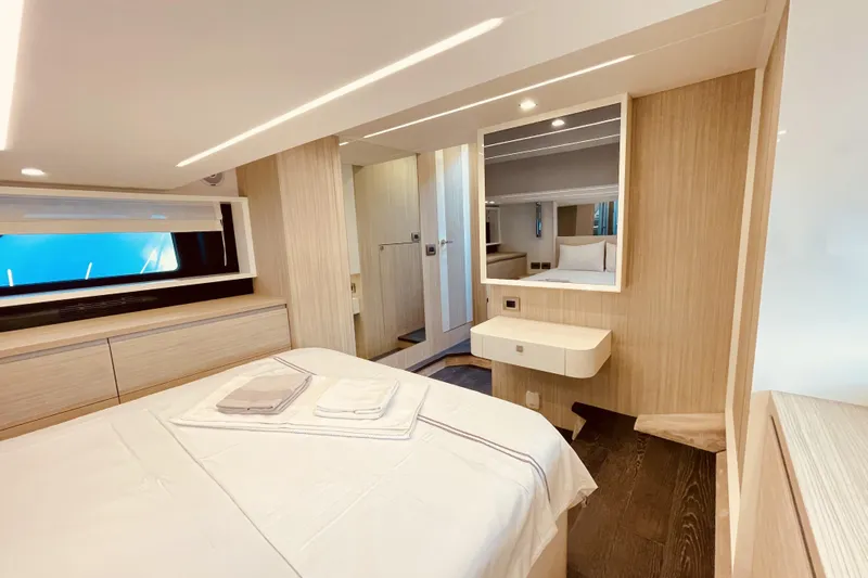  Yacht Photos Pics Luxurious 2020 Cranchi E 52F Evoluzione yacht bedroom with modern design and elegant furnishings.
