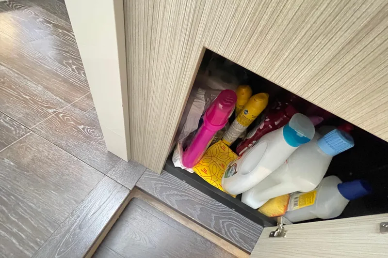  Yacht Photos Pics Storage cabinet with cleaning supplies on Cranchi E 52F Evoluzione yacht, 2020 model.