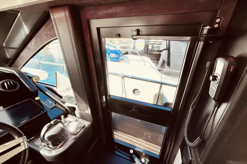  Yacht Photos Pics Interior view of 2020 Cranchi E 52F Evoluzione yacht cockpit and door.