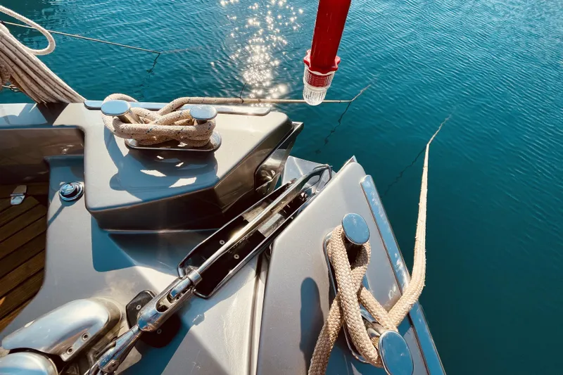  Yacht Photos Pics 2020 Cranchi E 52F Evoluzione yacht deck with ropes and cleats on calm water.