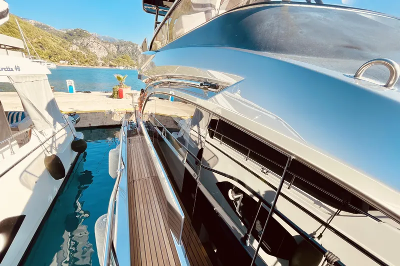  Yacht Photos Pics 2020 Cranchi E 52F Evoluzione yacht docked in scenic marina setting.