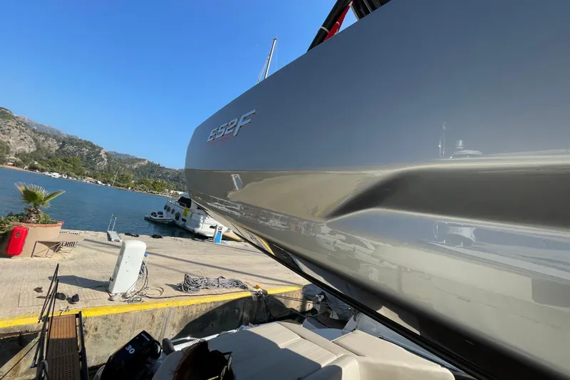  Yacht Photos Pics 2020 Cranchi E 52F Evoluzione yacht docked by scenic waterfront.