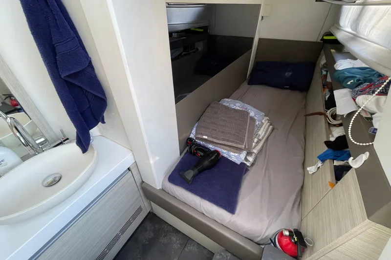  Yacht Photos Pics 2020 Cranchi E 52F Evoluzione cabin interior with bed, sink, and storage.
