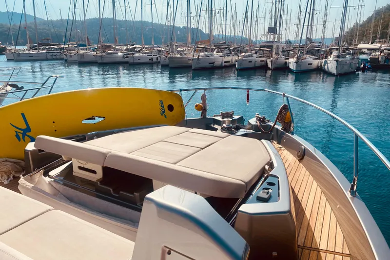  Yacht Photos Pics 2020 Cranchi E 52F Evoluzione yacht with paddleboard, docked in marina.