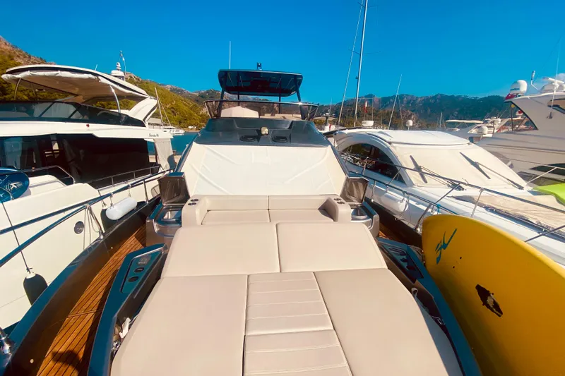  Yacht Photos Pics Luxury Cranchi E 52F Evoluzione yacht docked, 2020 model, surrounded by other boats.