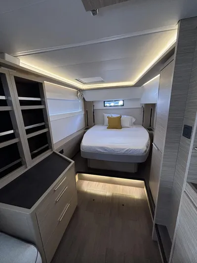  Yacht Photos Pics Luxurious cabin interior of 2025 Lagoon 46 yacht with modern lighting and cozy bed.