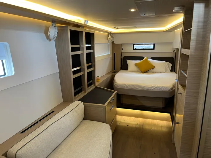  Yacht Photos Pics Luxurious interior of 2025 Lagoon 46 yacht with cozy bed and modern furnishings.