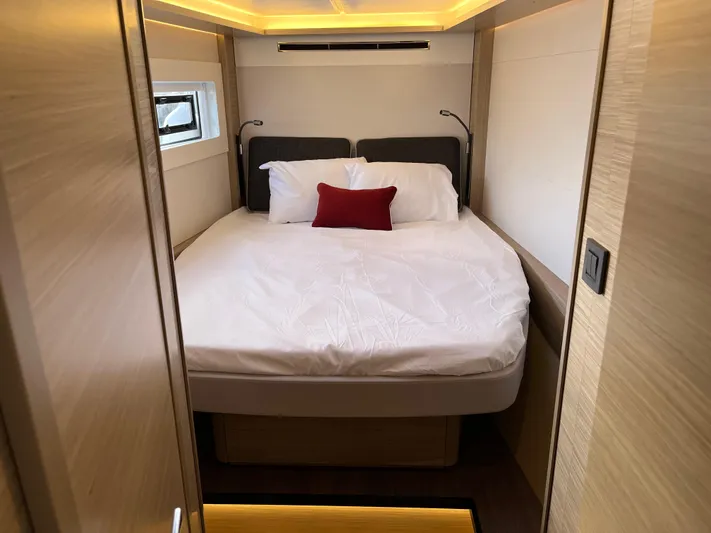  Yacht Photos Pics Luxurious bedroom interior of 2025 Lagoon 46 yacht with modern lighting.