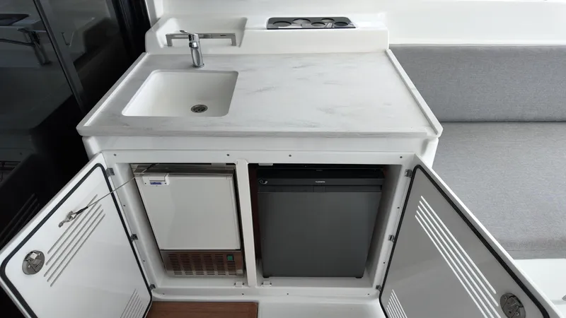  Yacht Photos Pics Modern kitchen area in 2025 Lagoon 46 yacht with sink and storage.