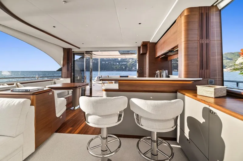  Yacht Photos Pics Luxurious interior of 2025 Princess Y72 yacht with elegant seating and ocean view.