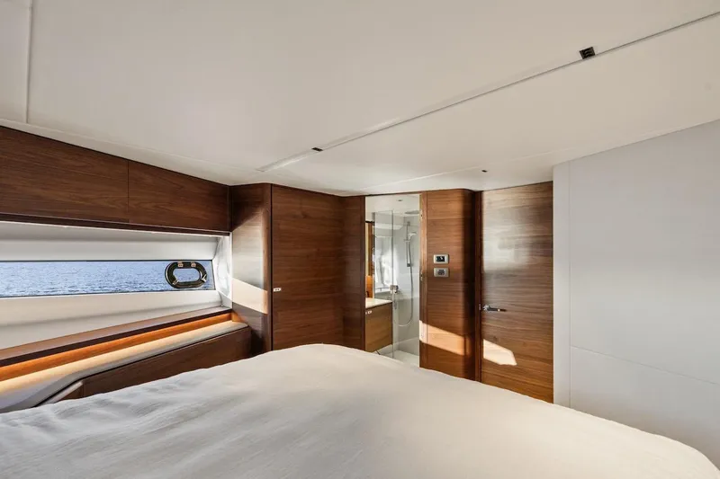  Yacht Photos Pics Luxurious interior of 2025 Princess Y72 yacht with modern wood finishes and ocean view.