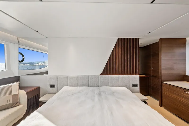  Yacht Photos Pics Luxurious bedroom interior of 2025 Princess Y72 yacht with modern design and ocean view.