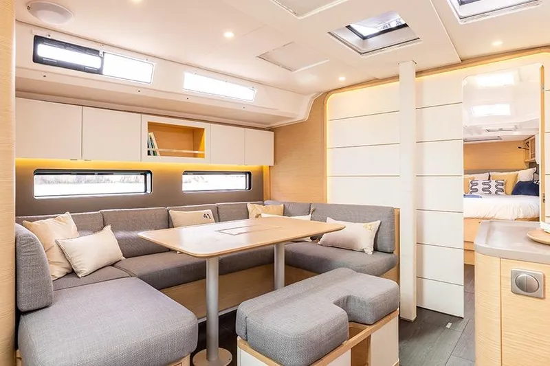  Yacht Photos Pics Modern interior of 2026 Dufour 41 yacht with cozy seating and elegant design.