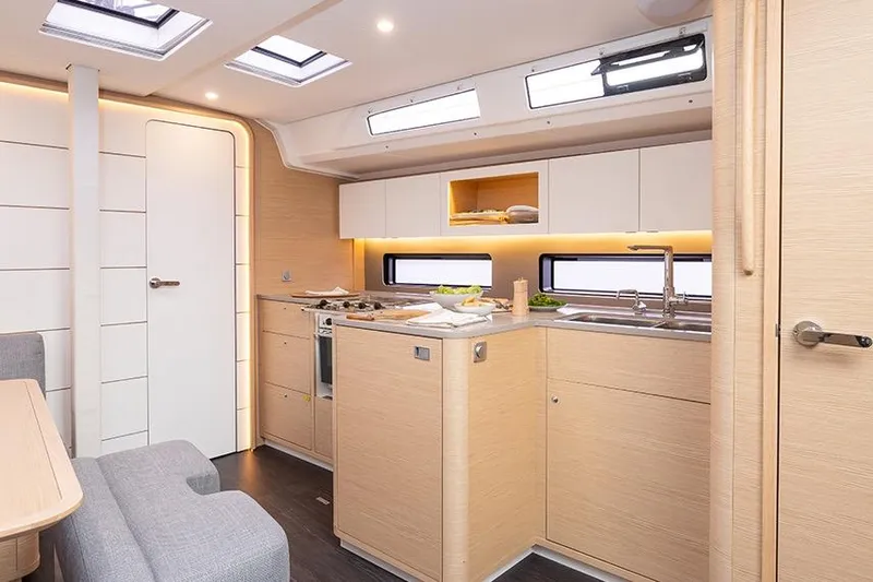  Yacht Photos Pics Modern kitchen interior of 2026 Dufour 41 yacht with sleek design and ample lighting.