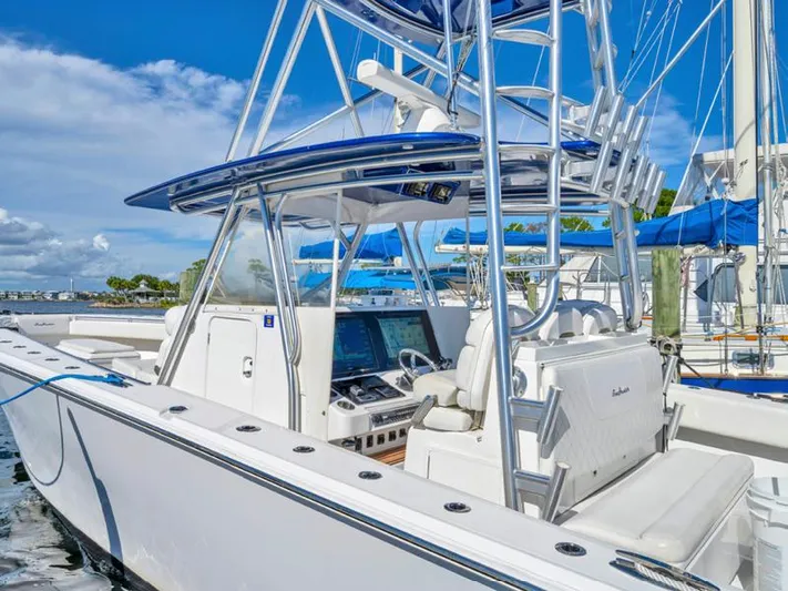  Yacht Photos Pics 2015 SeaHunter 45 boat with advanced navigation system and seating, docked at marina.